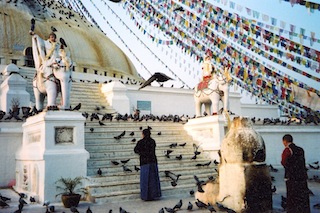 Bouddnath with pilgrim and birds.JPG